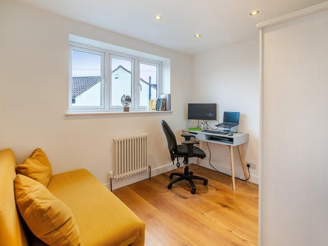Versatile space used currently as a home office.