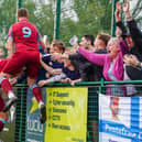 Pontefract Collieries players and supporters celebrate the winning goal at Stcokton Town. Picture: Josh Harper
