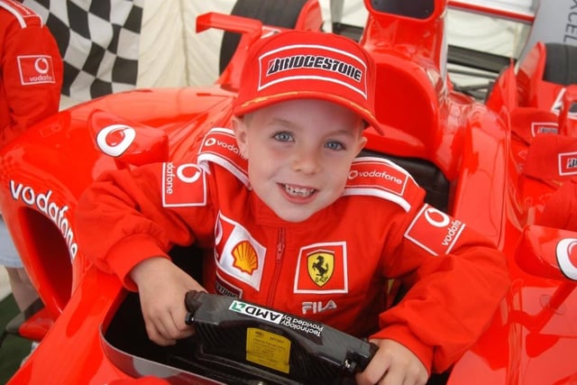 Curtis Deal, 6, from Sharlston, gets to grips with the driving techniques of a Ferrari at Asda, in aid of Dogs for the Deaf.