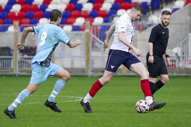 New signing Jack Cairney brings the ball out for Wakefield AFC. Photo by Scott Merrylees