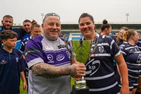 Featherstone Rovers Women captain Brogan Churm receives the Natalie Horrowell Cup. (Photo by JLH Photography)