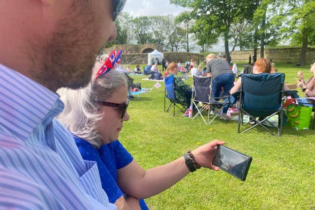 Guy and Natalie Beckett resorted to watching the ceremony on a mobile phone