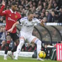 Leeds United captain Luke Ayling shields the ball from Manchester United goal scorer Marcus Rashford.