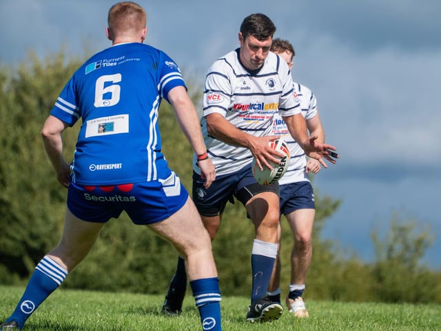 The returning Rich Frankland puts in a grubber kick for Featherstone Lions.