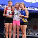 Sienna Lavine (centre) after her record breaking victory at the Yorkshire Championships.