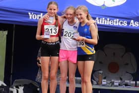 Sienna Lavine (centre) after her record breaking victory at the Yorkshire Championships.
