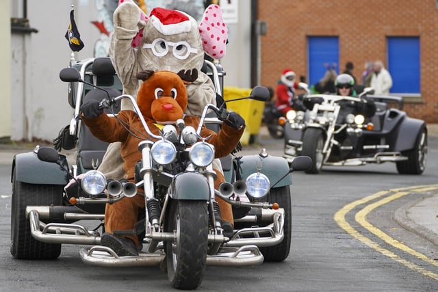 Hundreds of bikers in Christmas fancy dress arrived in Pontefract town centre to deliver food parcels to Pontefract Community Kitchen.