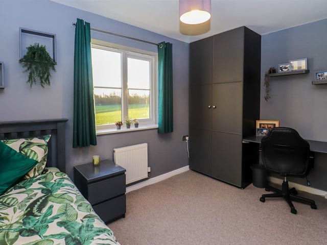 This bedroom with a view also has space for a study or work from home area.