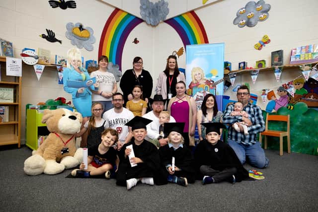 Flashback to children and their parents attending celebrations, in March, to mark their 'graduation' from the Dolly Parton Imagination Library..