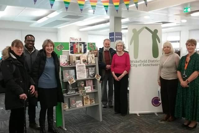 Wakefield District City of Sanctuary presented Linda Fielding with the books that were bought for Ukrainian refugees in lieu of a leaving present at Wakefield library earlier this week.