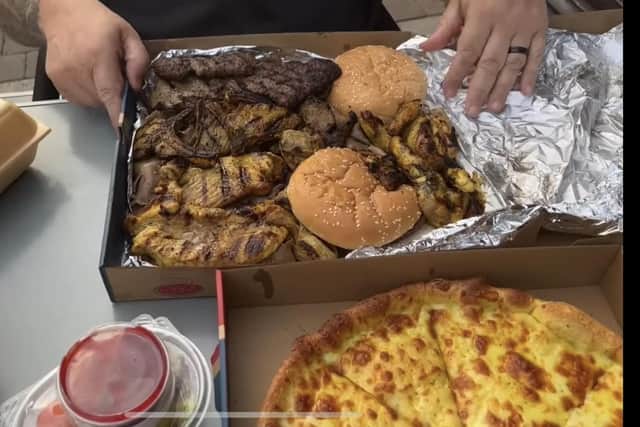 Danny had a 'munch box' which included various meats, two chips, some cans of pop, and a garlic cheesy bread pizza. Image: Rate My Takeaway.