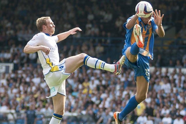 Leeds United win a penalty as Pontefract-born Paul Green's flick up is handled by Shrewsbury defender Michael Hector. It was a winning start to the 2012-13 season for the Whites as they won 4-0 in the Capital One Cup first round and success for Green in his first competitive match for Leeds.