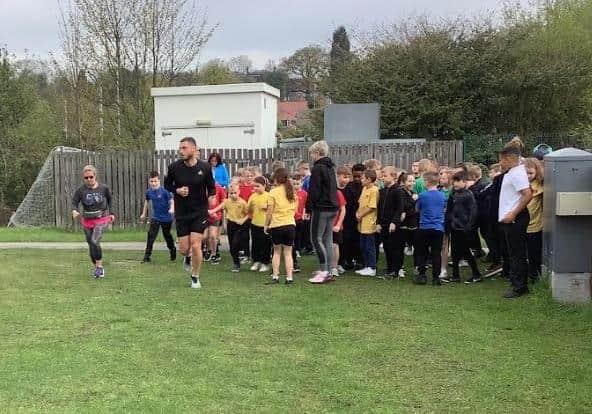Pupils watched as they ran 21 miles in preperation.
