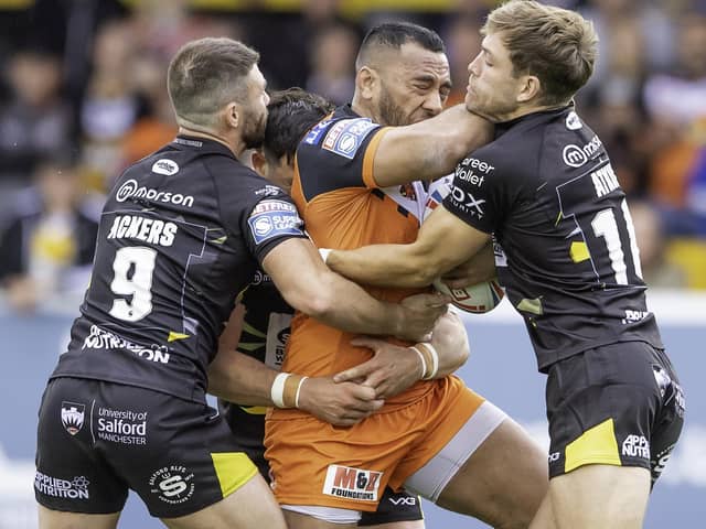 Castleford Tigers' Suiai Matagi is tackled by Salford trio Andy Ackers, Shane Wright and Chris Atkin. Picture: Allan McKenzie/SWpix.com