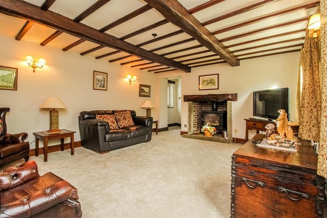 Ceilings with wooden beams and open rustic fireplaces feature within the rooms.