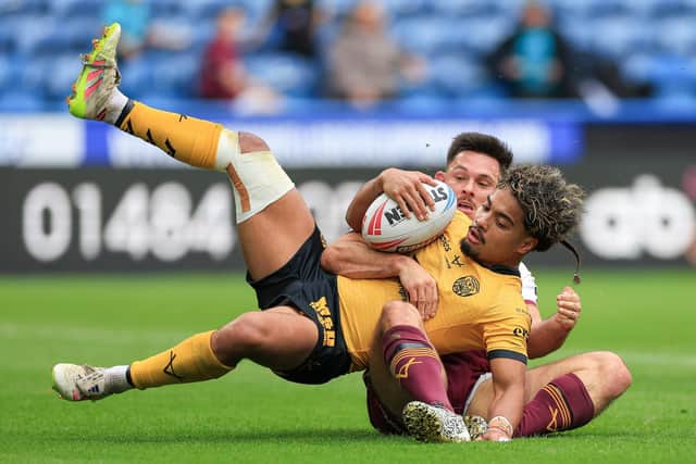 Castleford Tigers full-back Phoenix Laulu Togaga'e is tackled. Picture by Callum Pilkington/SWpix.com