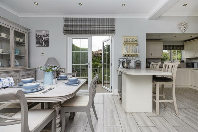 The open plan kitchen with diner has French doors out to the garden.