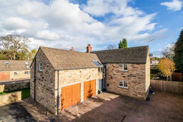 The stone built property with double garage is for sale priced £795,000.