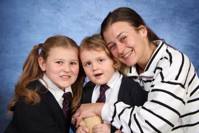 Thea-Mae with mum and sister Aya.