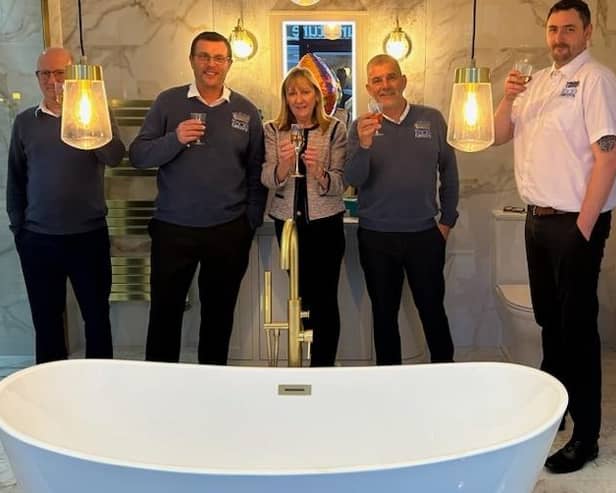 Sandra Marchington, centre, and her husband Paul, second from left, celebrate the completion of the Castleford showrooms with staff Mark Radley, Paul Warris and Will Green.