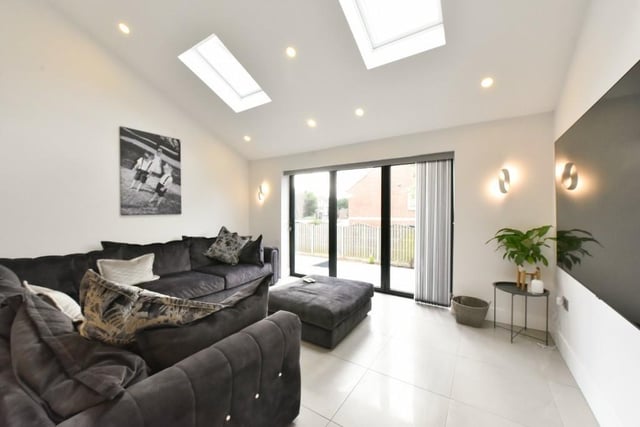 The lounge area has porcelain tile throughout, spotlights to vaulted ceiling and bifold doors which lead to the to rear, sunny positioned, garden.