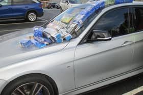 Two cars  and illegal cigarettes were seized after raids on two shops in Pontefract area