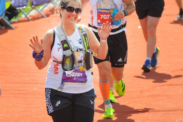 Lindsey Burrow seen crossing the finish line of the 2025 Rob Burrow Leeds Marathon. Picture by Steve Riding.