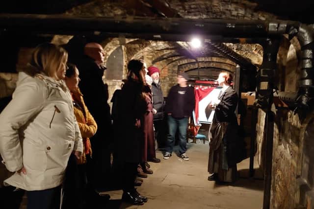 Volunteer, Olivia Young during one of the catacomb tours.