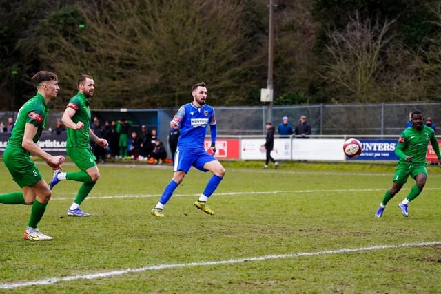 Dec Bacon shoots to score a goal on his debut for Pontefract Collieries.