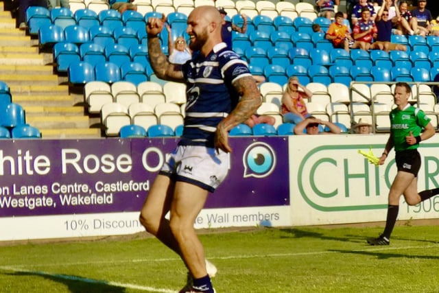 Luke Briscoe does a dance of delight after scoring a try.