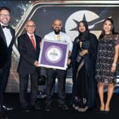 Chef Shamsul Miah receiving the Curry Life Best Chef of the Year award. From left to right, host Jon Kay from the BBC, former MP Virendra Sharma, Chef Shamsul Miah, Mrs Miah and Luxmy Gopal of the BBC