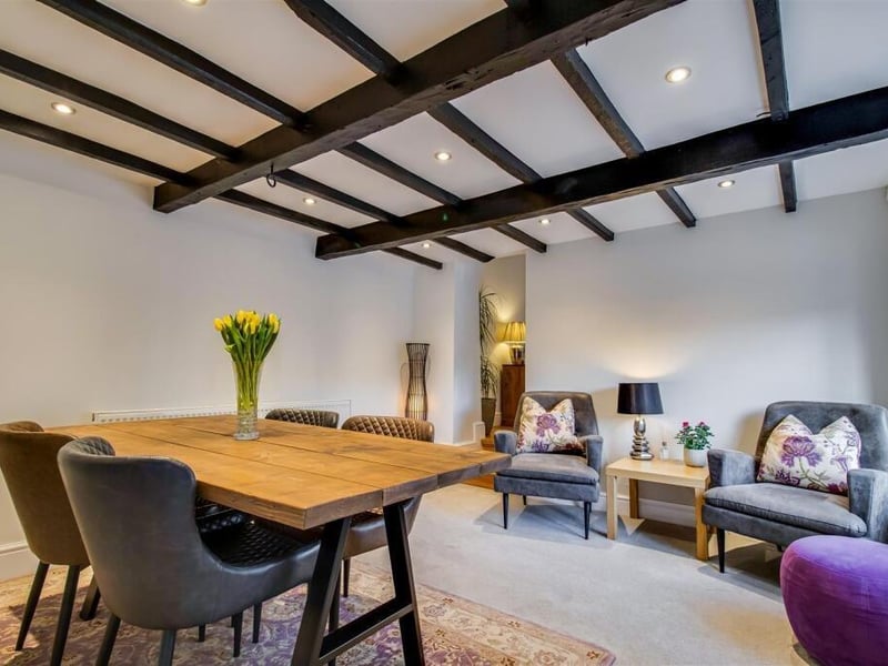 This lovely room features a UPVC double glazed window to the front, a radiator, exposed wooden beams and recess ceiling spotlights.