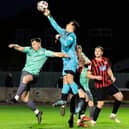 Goole goalkeeper Alfie Stevens-Neale gets up highest to punch the ball away as Frickley Athletic go on the attack. Picture: John Hobson www.johnhobsonphotographer.co.uk