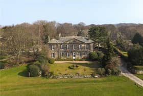 The imposing property stands in lovely landscaped grounds that include a listed 'ha-ha'.