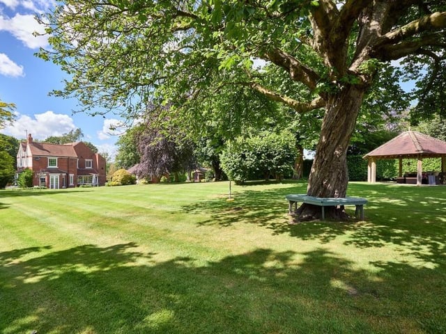 A mature, tree-lined boundary at the front and rear adds an immense sense of privacy.