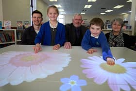 Chris Baird from Social Ability, Coun Graham Isherwood of Featherstone Town Council, Lynne Holroyd of Wakefield Libraries with Max and Lyla of Purston Infant School.