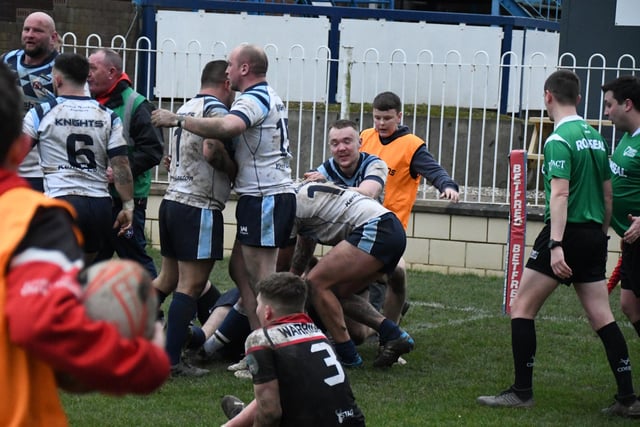 Normanton Knights players begin to celebrate scoring the winning try.