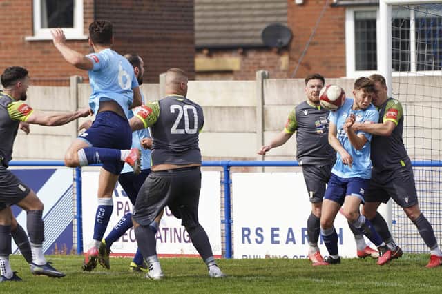 Ossett United number six Harry Coates sees his header blocked against Grantham Town. Picture: Scott Merrylees