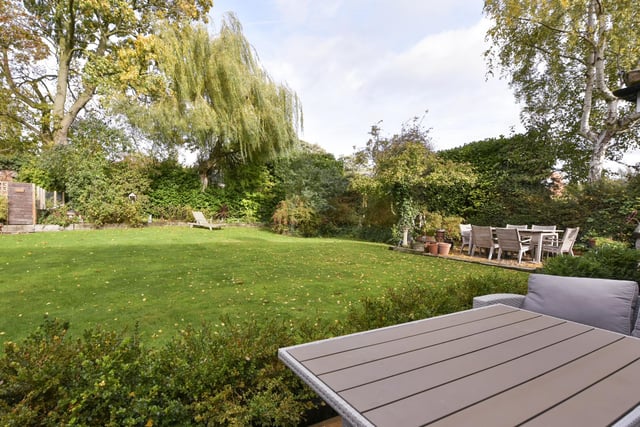 The private and enclosed rear garden has a lawn, with well stocked borders, a block paved patio, an area of decking and a pebbled area.