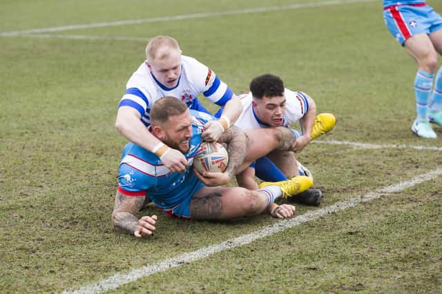 Wakefield Trinity's Josh Griffin is tackled by Oli Lewis of Siddal in Saturday's Challenge Cup match
