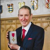 David Deaves with his OBE at Windsor Castle.