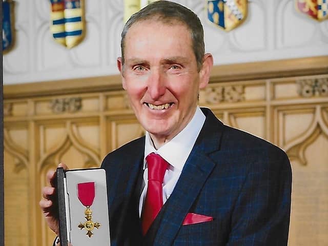 David Deaves with his OBE at Windsor Castle.