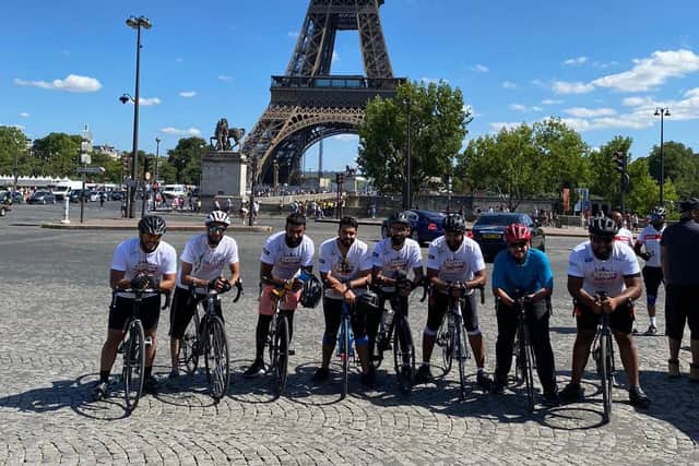 Some of the riders outside the Eiffel Tower in Paris.