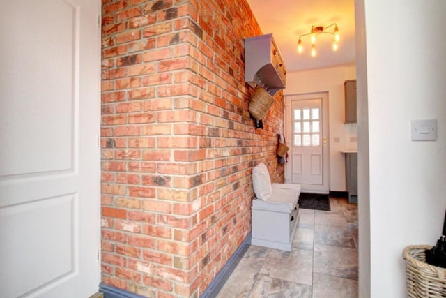 As you enter the property, you'll find a stunning exposed brick entrance hall.