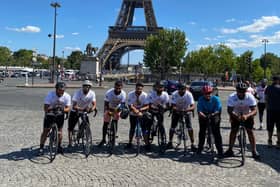 Some of the riders outside the Eiffel Tower in Paris.