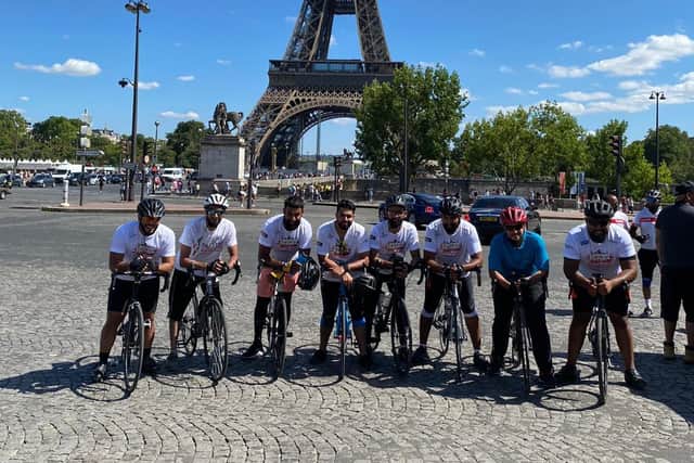 Some of the riders outside the Eiffel Tower in Paris.