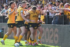 Castleford Tigers players celebrate a try with fans during the 2026 season. Picture: Rob Hare