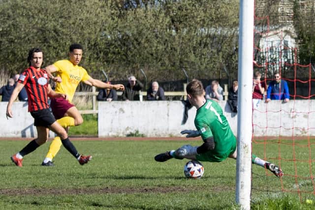 Ruben Jerome scores one of Emley's five goals at Goole. Picture: Mark Parsons