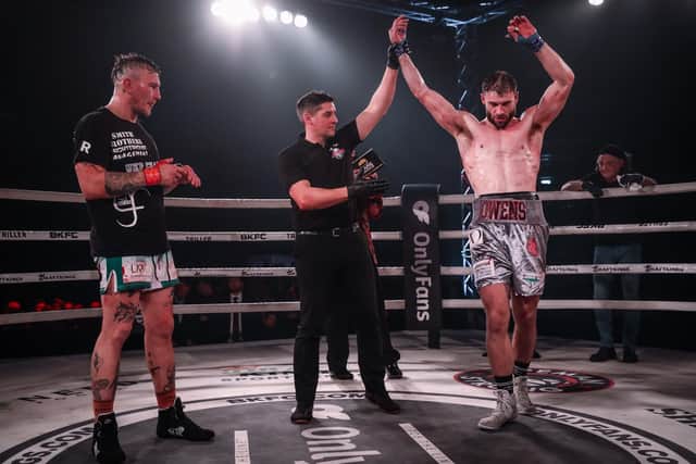Nathan Owens has his hand raised after winning his first bareknuckle boxing fight against David Round.