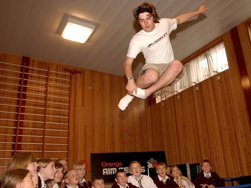Snow boarding lesson, Crofton High School. Professional free style skier Mike Wakefield shows off his skills.